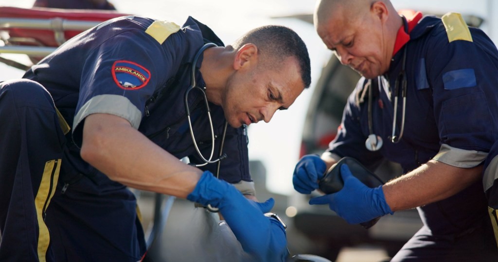 EMT's administrating naloxone to overdoe patient 